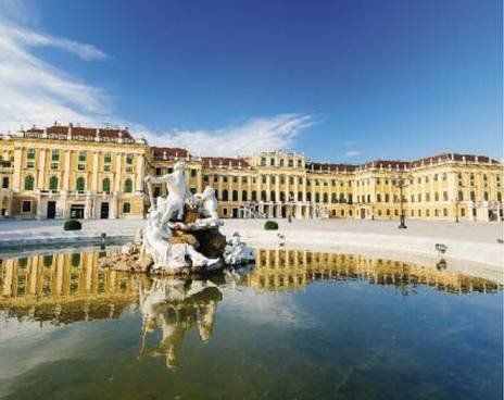 Schoenbrunn Palace Vienna on a summer day. The palace, with the fountain in front