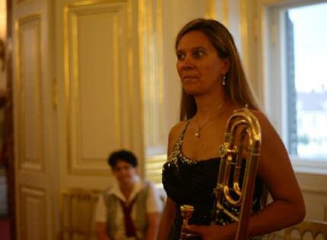 A musician of the Schoenbrunn Palace concerts on her way to the concert, instrument in hand